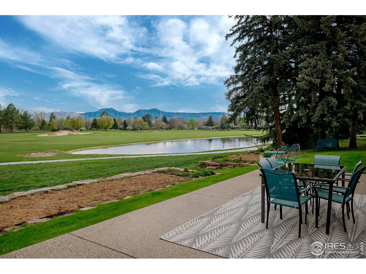7034 Indian Peaks Trail Boulder, CO 80301 - Photo 2 of 40 a view of a table and chairs in the garden