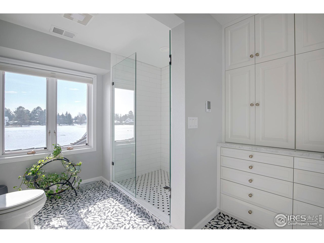 7034 Indian Peaks Trail Boulder, CO 80301 - Photo 24 of 40 a bathroom with a toilet a sink and a window