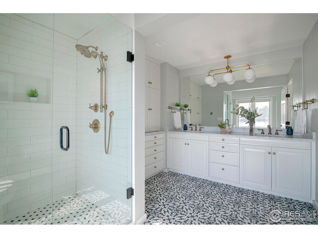 7034 Indian Peaks Trail Boulder, CO 80301 - Photo 25 of 40 a bathroom with a sink a toilet and shower