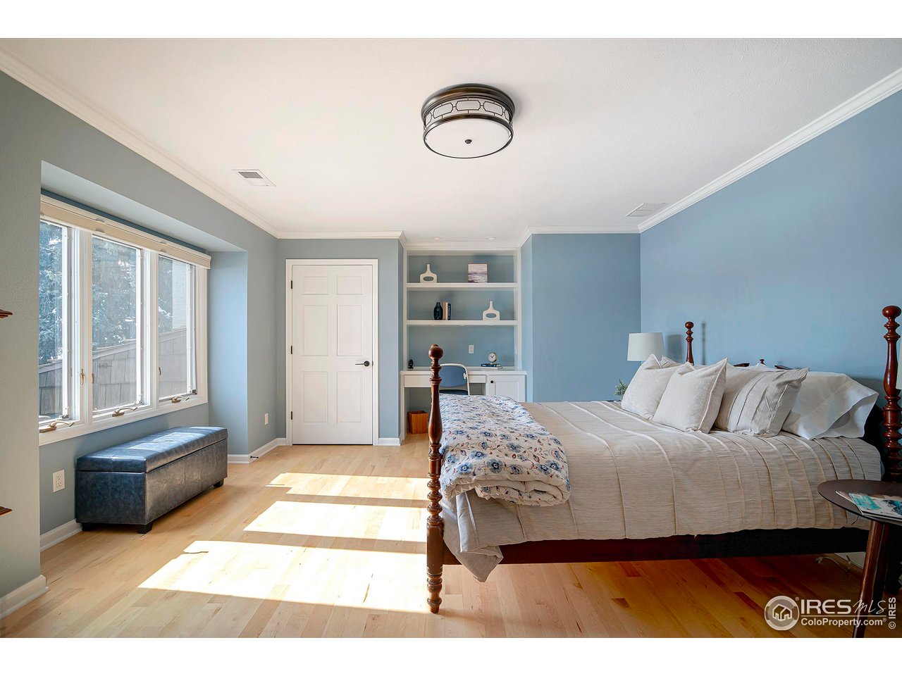 7034 Indian Peaks Trail Boulder, CO 80301 - Photo 27 of 40 a bedroom with a bed and a large window