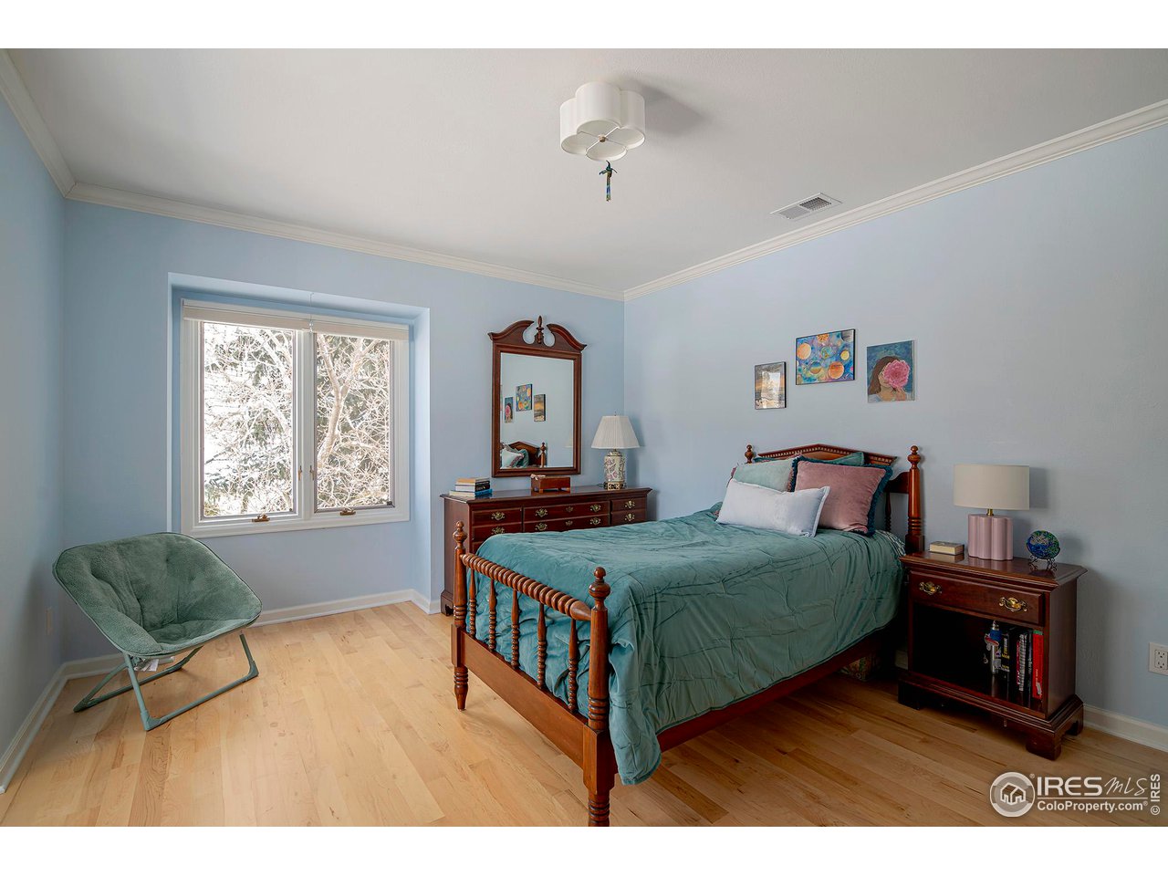 7034 Indian Peaks Trail Boulder, CO 80301 - Photo 29 of 40 a bedroom with a bed a dresser and a large window