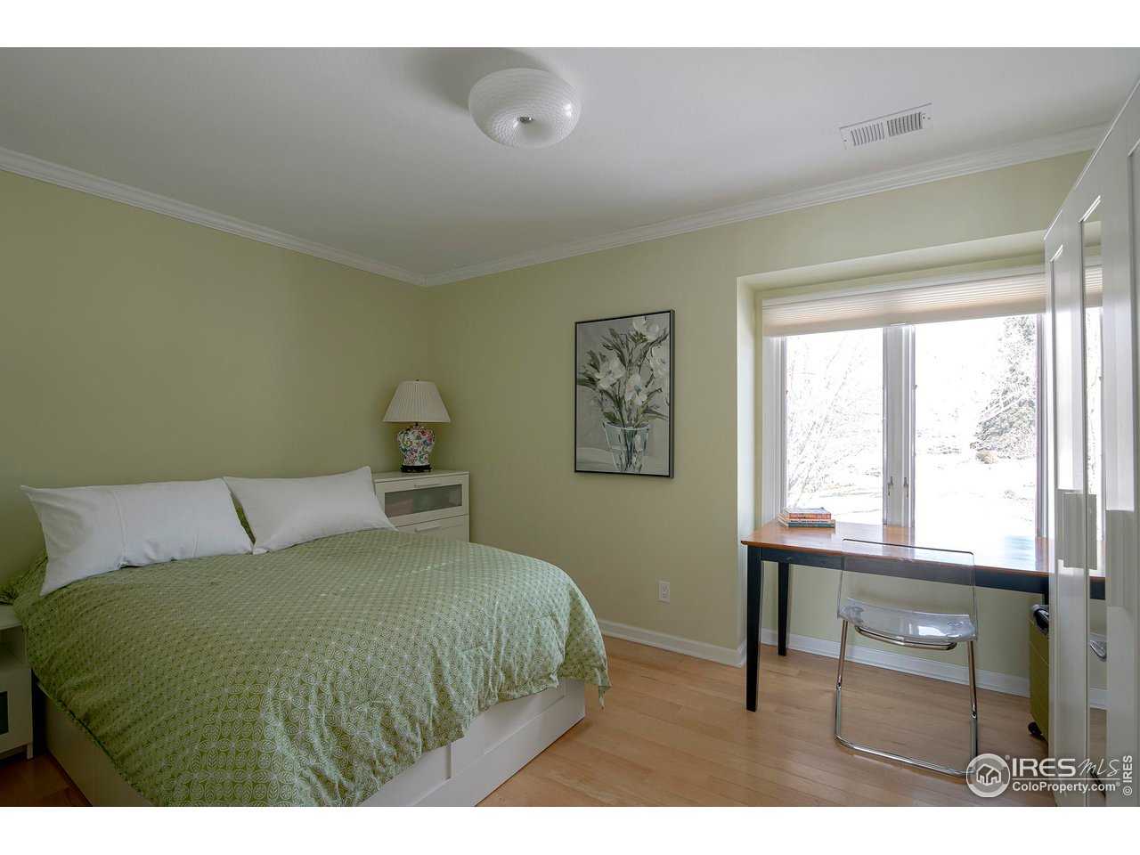 7034 Indian Peaks Trail Boulder, CO 80301 - Photo 31 of 40 a bedroom with a bed and a window