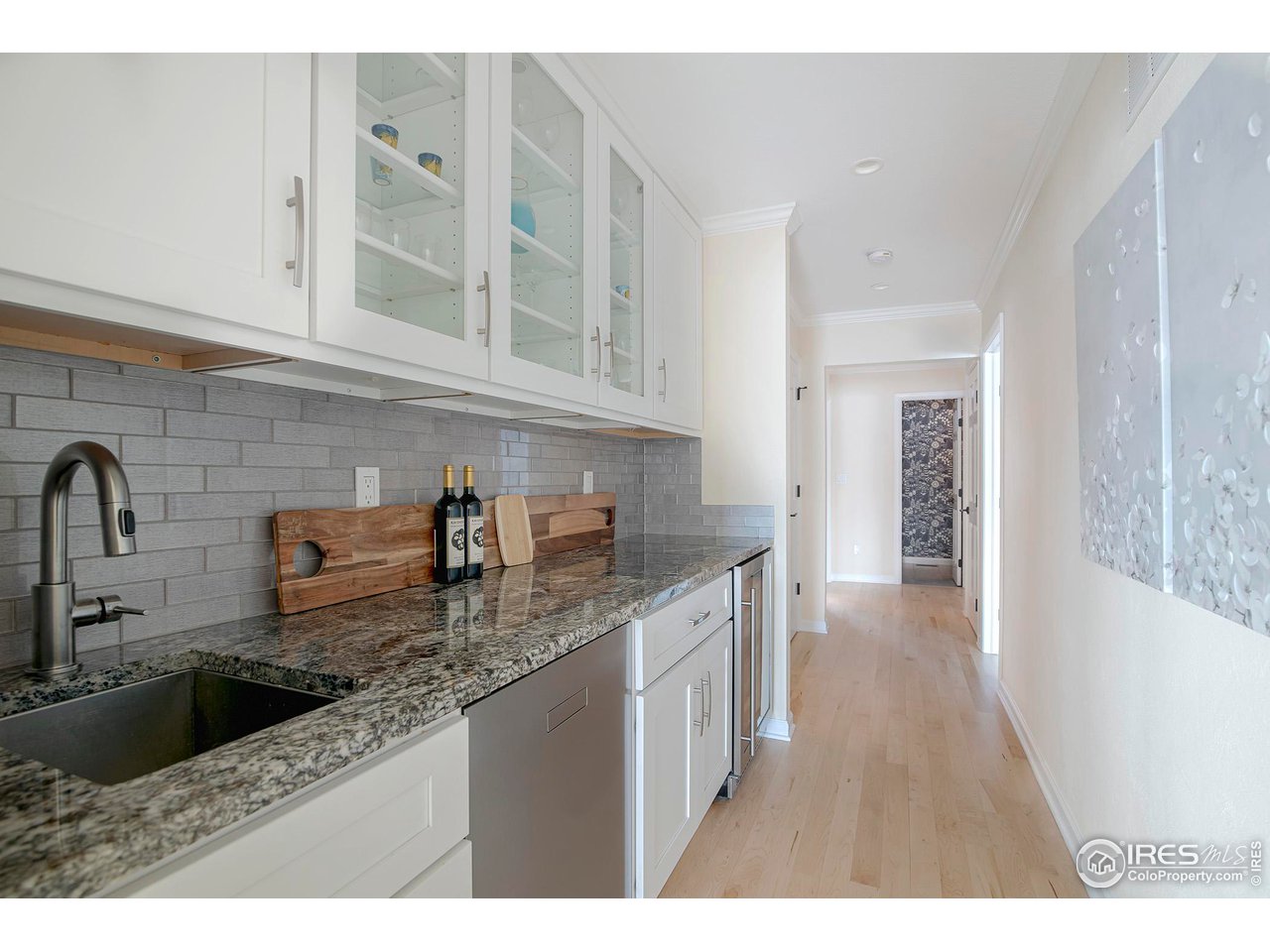 7034 Indian Peaks Trail Boulder, CO 80301 - Photo 35 of 40 a kitchen with stainless steel appliances granite countertop a sink stove and cabinets
