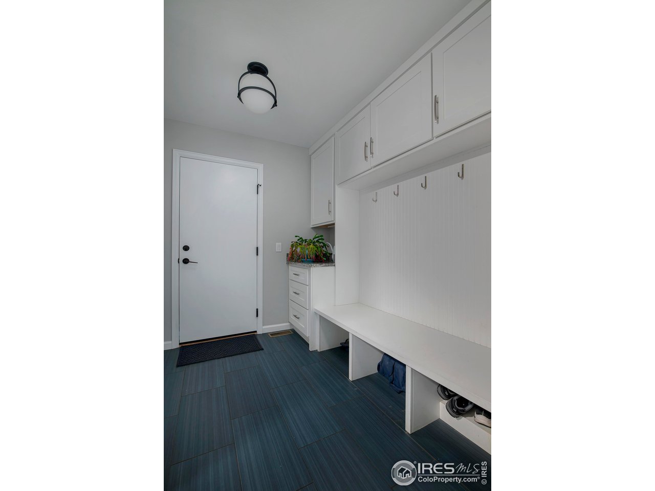 7034 Indian Peaks Trail Boulder, CO 80301 - Photo 37 of 40 a view of a room with wooden floor and entryway