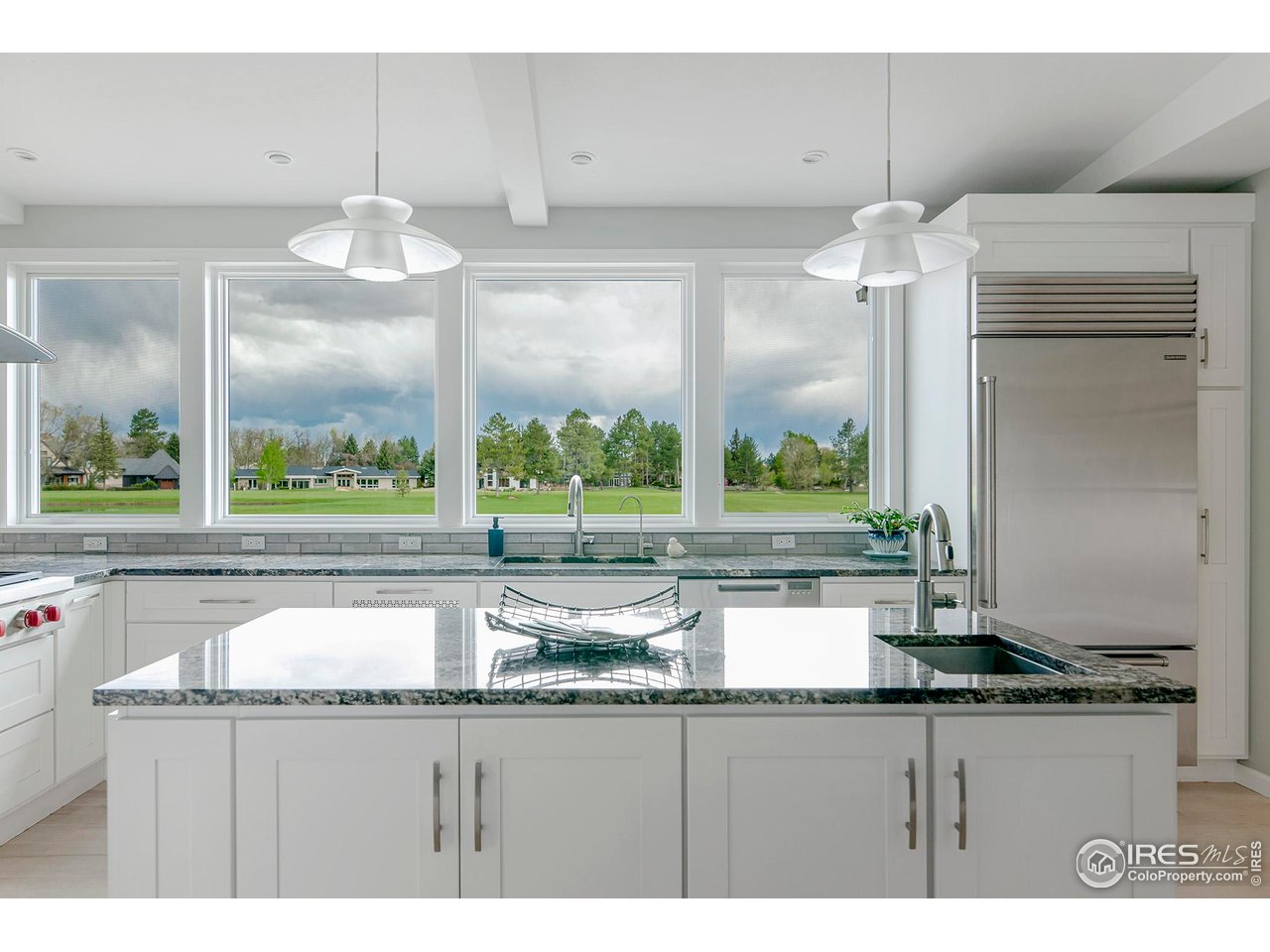 7034 Indian Peaks Trail Boulder, CO 80301 - Photo 4 of 40 a kitchen with a sink and a large window