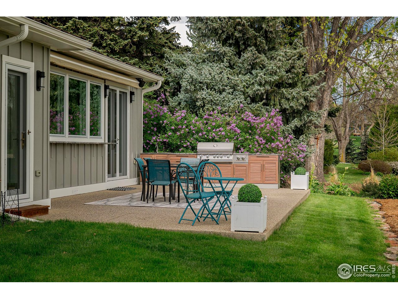 7034 Indian Peaks Trail Boulder, CO 80301 - Photo 5 of 40 a view of a house with a yard and sitting area