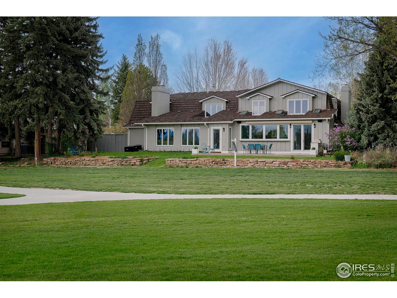 7034 Indian Peaks Trail Boulder, CO 80301 - Photo 7 of 40 a front view of a house with a garden