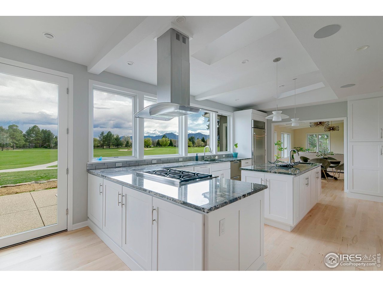 7034 Indian Peaks Trail Boulder, CO 80301 - Photo 10 of 40 a kitchen with kitchen island granite countertop a sink and a large window