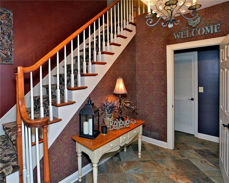 111 McDermott Road Trafford, PA 15085 - Photo 2 of 25 Enter the welcoming foyer from the attractive front porch. The entry level boasts a full bath with walk-in shower, laundry/utility room, 29x18 FR that could be split to accommodate another bedroom and/or kitchenette. This level could house guest living quarters with a separate entrance from the side patio to the family room. The 2 car garage is also on this level.