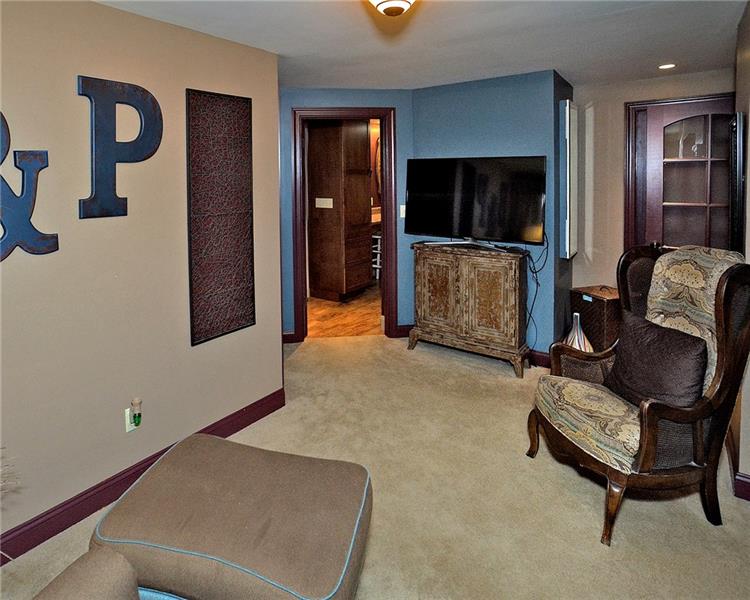 111 McDermott Road Trafford, PA 15085 - Photo 12 of 25 The master suite sitting room is perfect for relaxing! A laundry room was added to this floor during the renovation and is conveniently located adjacent to the master suite. Ironing board wall insert (mirrored) included!