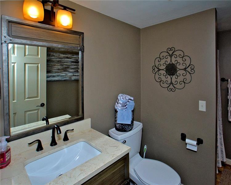 111 McDermott Road Trafford, PA 15085 - Photo 21 of 25 Beautiful updated main entrance level full bath with walk-in shower, tiled floor. One of 3.5 baths in this home.