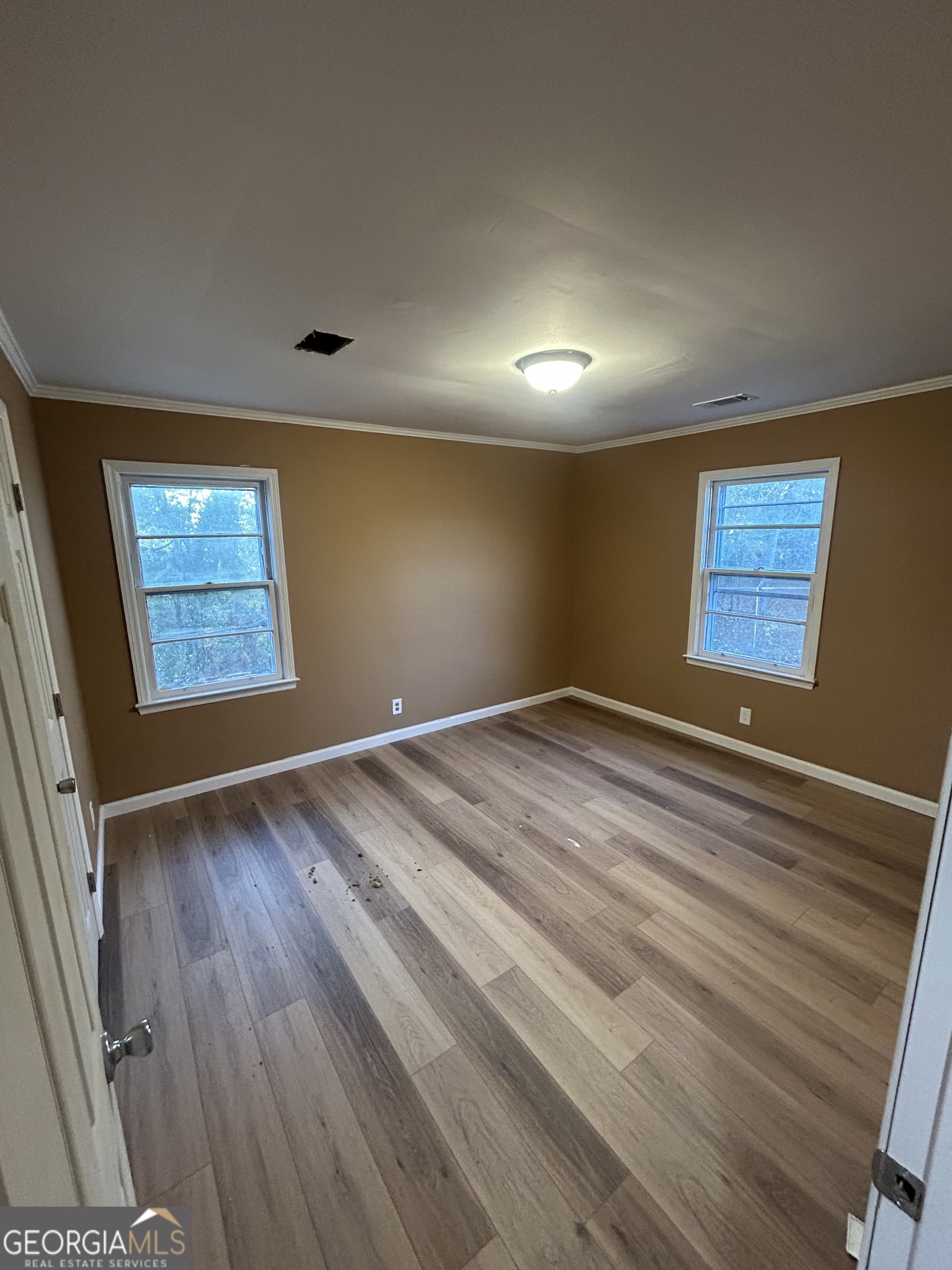 1545 Anthony Road Macon, GA 31204 - Photo 7 of 8 a view of an empty room and window