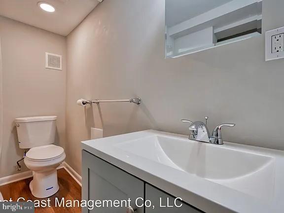917 North Calvert Street, Unit 1 Baltimore, MD 21202 - Photo 12 of 24 a bathroom with a sink and a toilet
