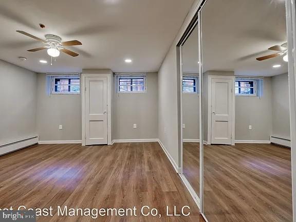 917 North Calvert Street, Unit 1 Baltimore, MD 21202 - Photo 15 of 24 an empty room with wooden floor and windows