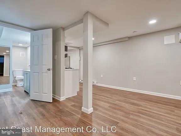 917 North Calvert Street, Unit 1 Baltimore, MD 21202 - Photo 20 of 24 wooden floor in an empty room with a window