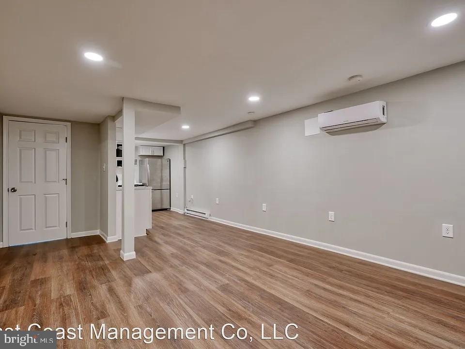 917 North Calvert Street, Unit 1 Baltimore, MD 21202 - Photo 22 of 24 a view of empty room with wooden floor