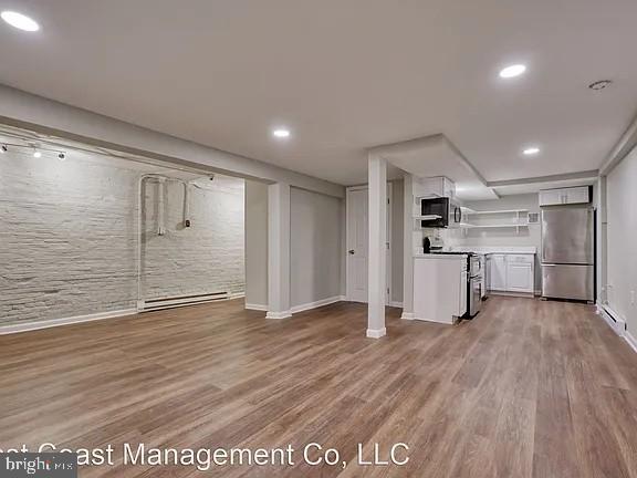 917 North Calvert Street, Unit 1 Baltimore, MD 21202 - Photo 9 of 24 a view of a kitchen with wooden floor
