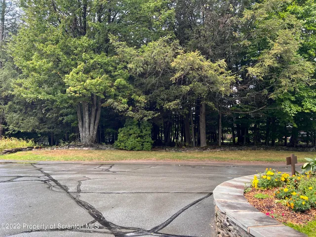 a view of a swimming pool in front of a house