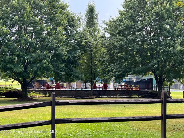 a view of swimming pool with chairs