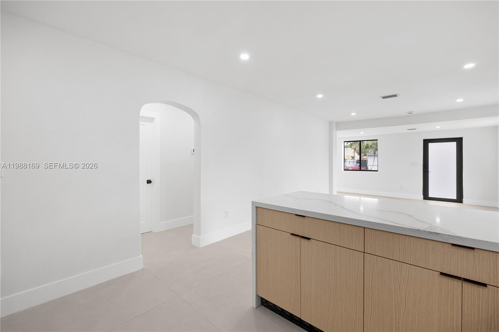 421 Northwest 81st Street Miami, FL 33150 - Photo 16 of 39 a hallway with sink and mirror