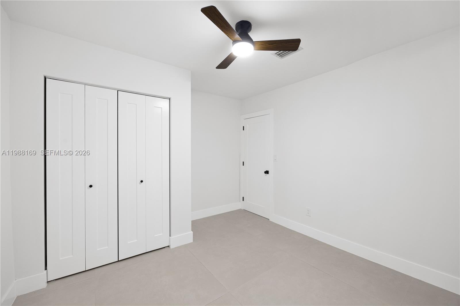 421 Northwest 81st Street Miami, FL 33150 - Photo 19 of 39 an empty room with a ceiling fan