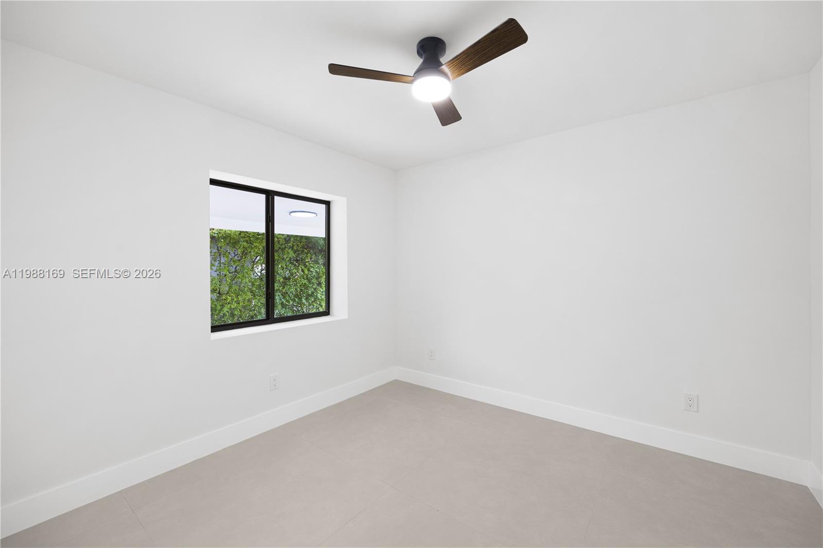 421 Northwest 81st Street Miami, FL 33150 - Photo 22 of 39 an empty room with a window