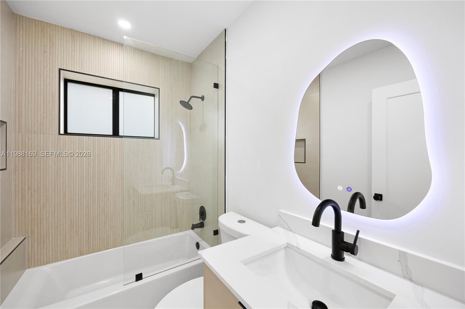 421 Northwest 81st Street Miami, FL 33150 - Photo 24 of 39 a bathroom with a sink and a mirror