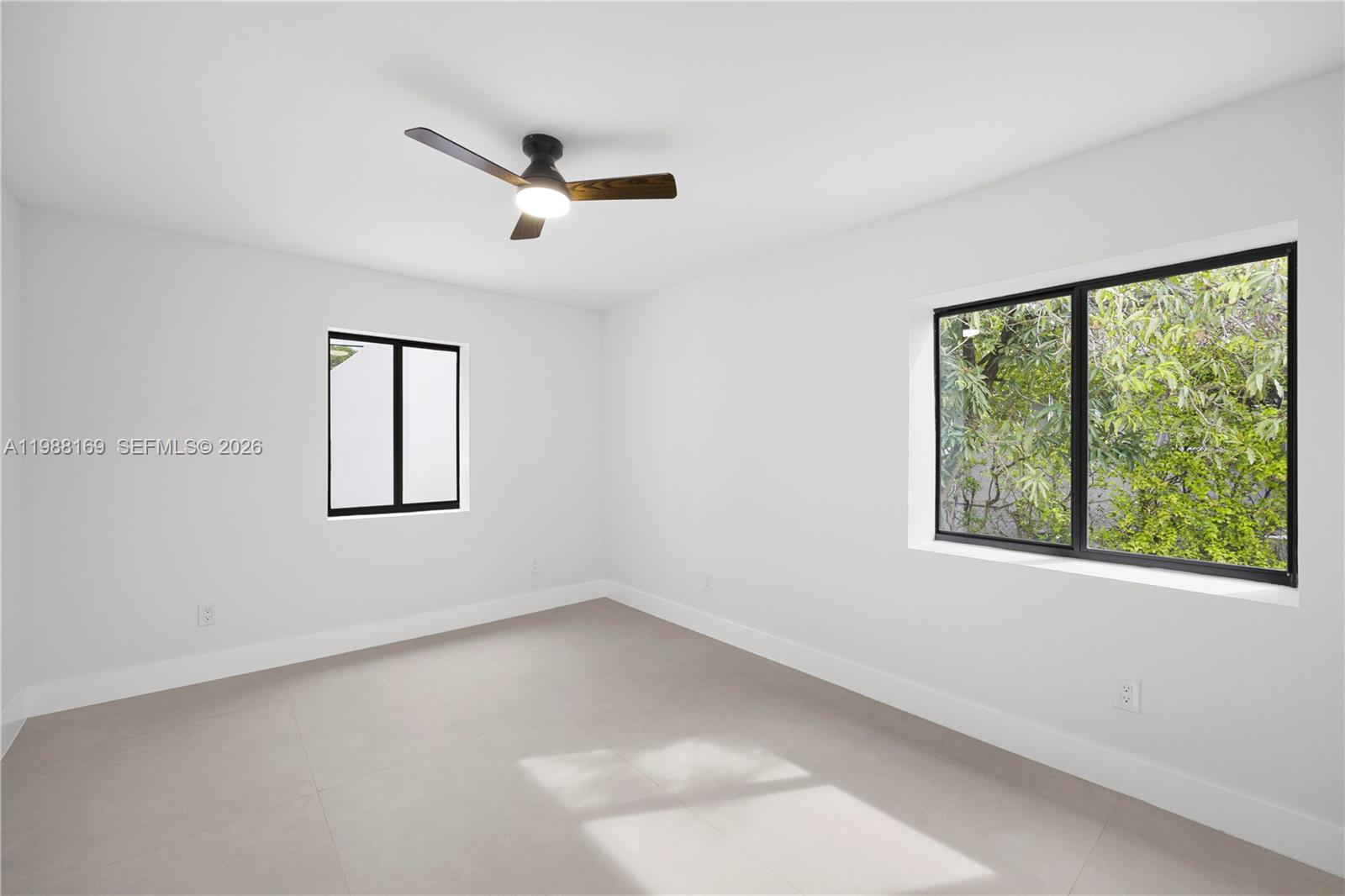421 Northwest 81st Street Miami, FL 33150 - Photo 27 of 39 an empty room with a window
