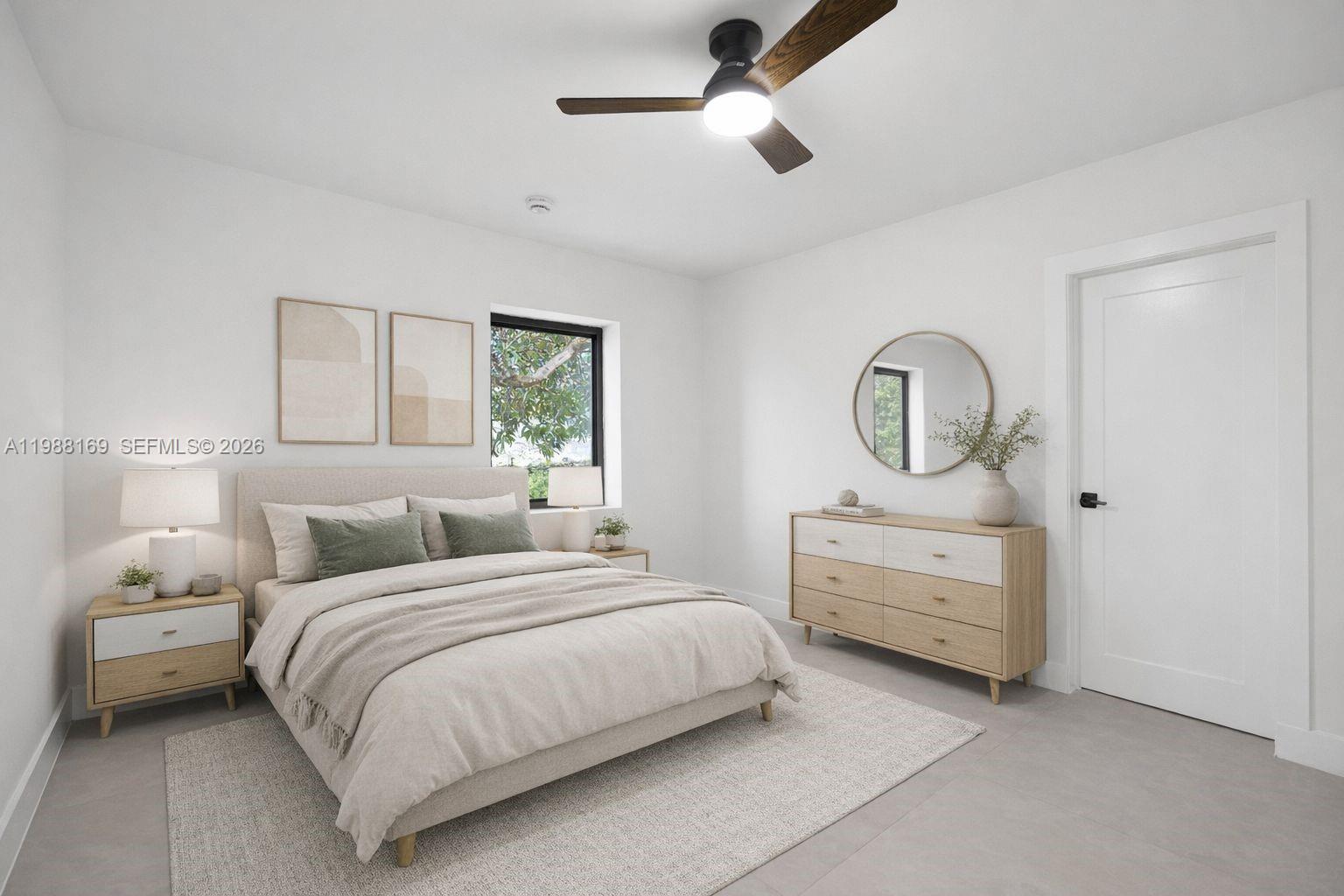 421 Northwest 81st Street Miami, FL 33150 - Photo 28 of 39 a bedroom with bed and window