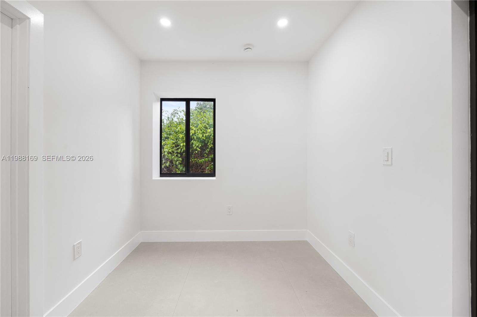 421 Northwest 81st Street Miami, FL 33150 - Photo 34 of 39 an empty room with a window