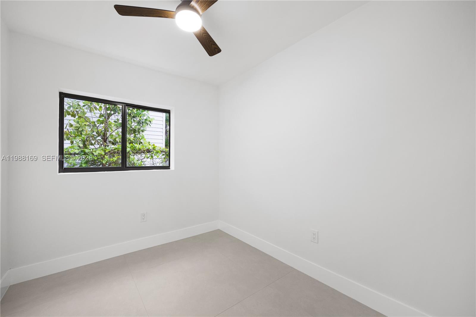 421 Northwest 81st Street Miami, FL 33150 - Photo 35 of 39 an empty room with a window