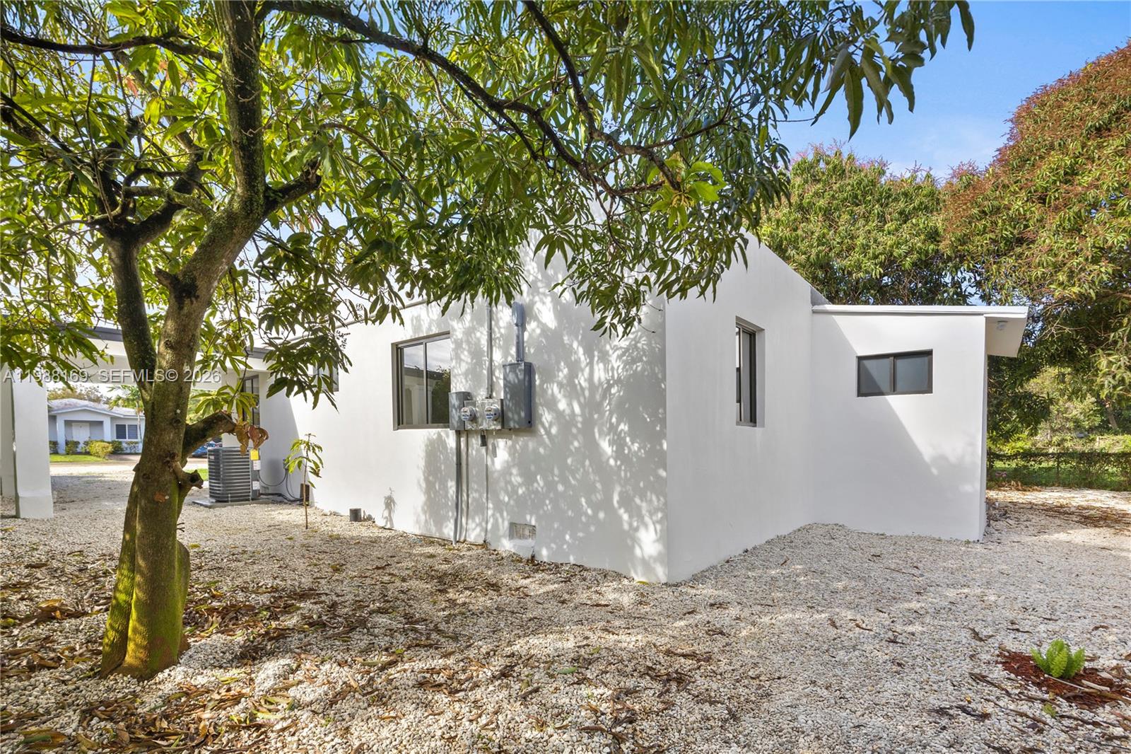 421 Northwest 81st Street Miami, FL 33150 - Photo 6 of 39 a view of a house with a tree