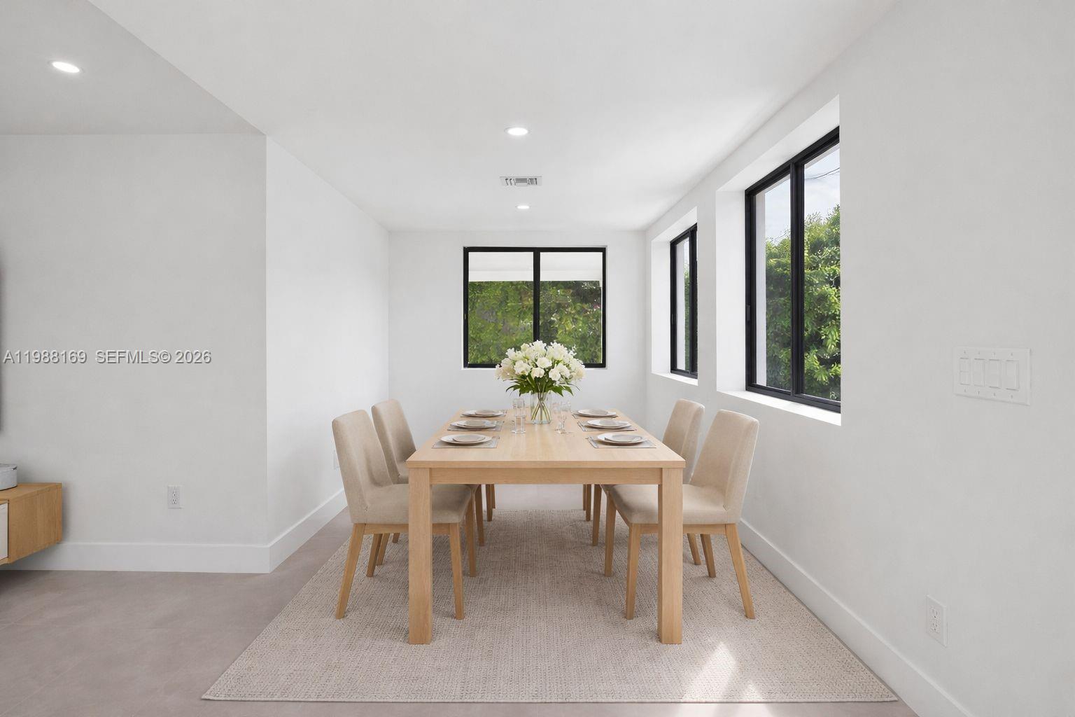 421 Northwest 81st Street Miami, FL 33150 - Photo 10 of 39 a dining room with furniture and window
