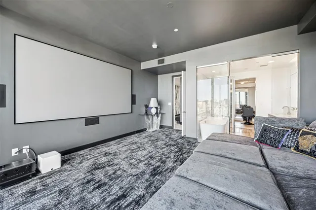 a bedroom with a large bed and a large window