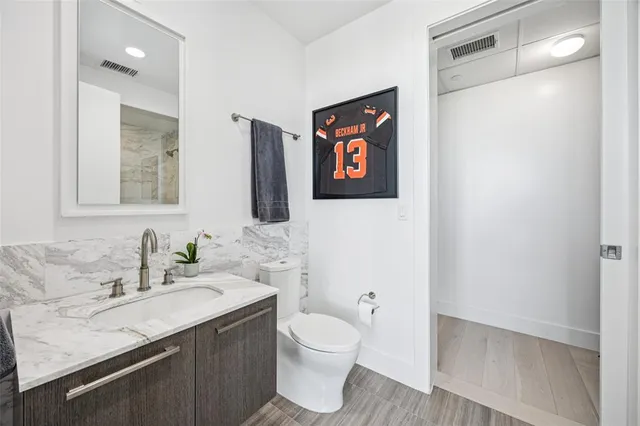 a bathroom with a shower and a mirror