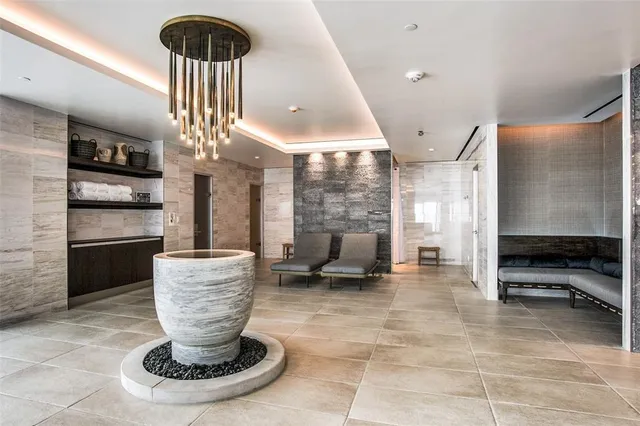 a kitchen with wooden cabinets and outdoor seating