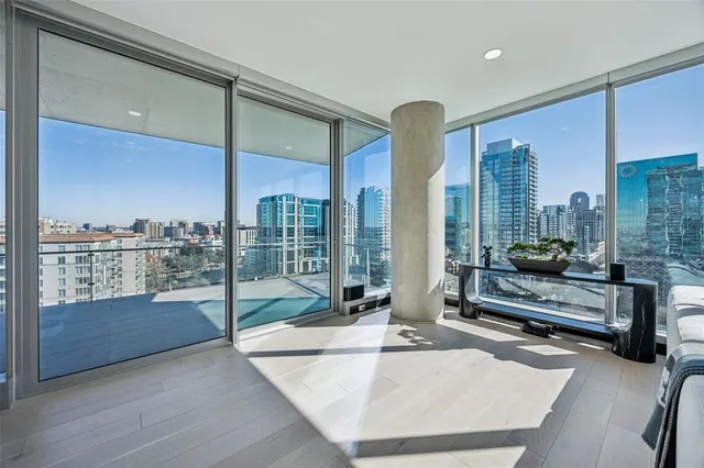 a view of living room with furniture and floor to ceiling window