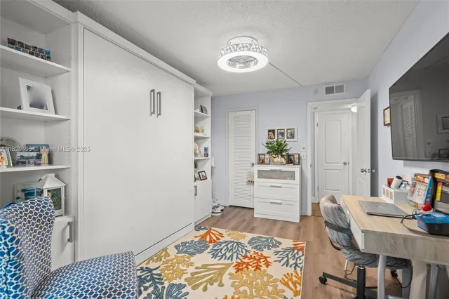 a bedroom with a bed and furniture