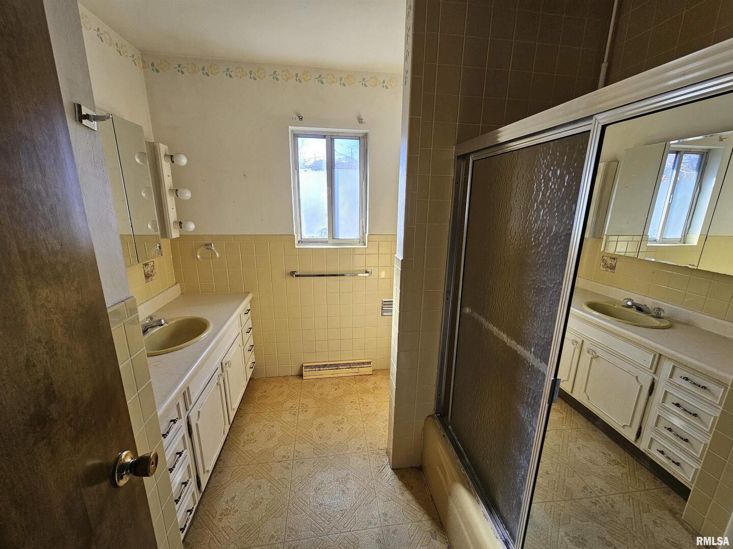 1604 Salem Road Mount Vernon, IL 62864 - Photo 18 of 21 a bathroom with a tub sink a mirror and a shower