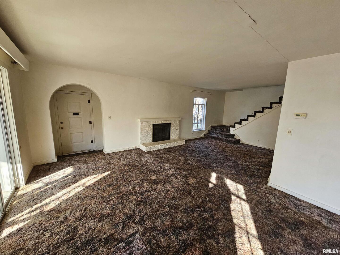 1604 Salem Road Mount Vernon, IL 62864 - Photo 8 of 21 a view of a big room with fireplace and wooden floor