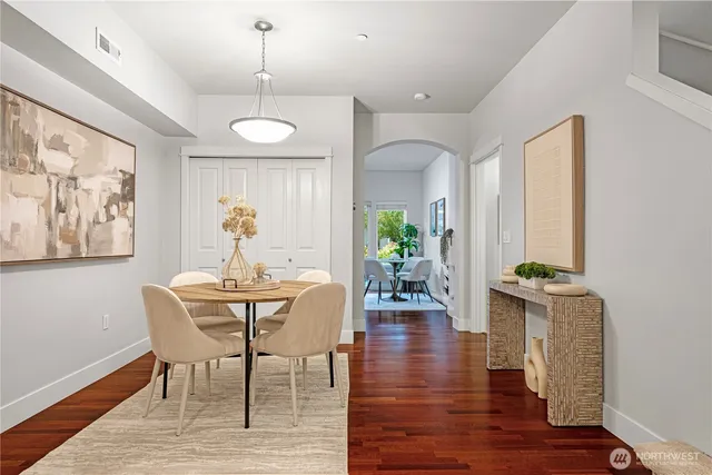 a view of a dining room with furniture window and wooden floor