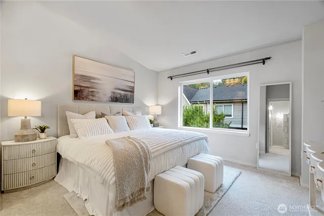 a bedroom with bed and window