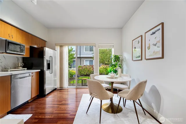 a dining room with furniture and window