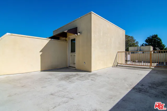 a view of backyard with large tree