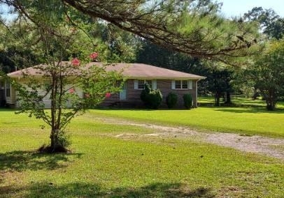 415 Crabapple Road Fayetteville, GA 30215 - Photo 1 of 1 a view of a house with a big yard