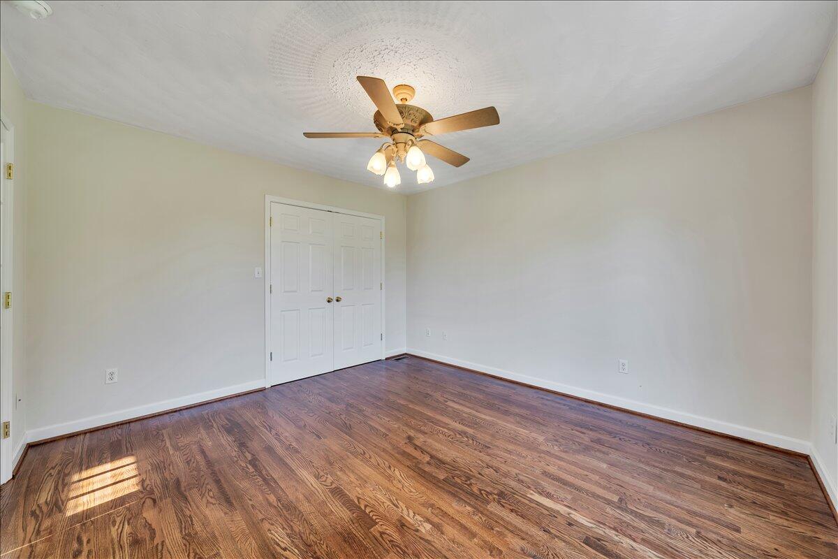 6510 Brookfield Road Roanoke, VA 24019 - Photo 24 of 119 a view of an empty room with window and wooden floor
