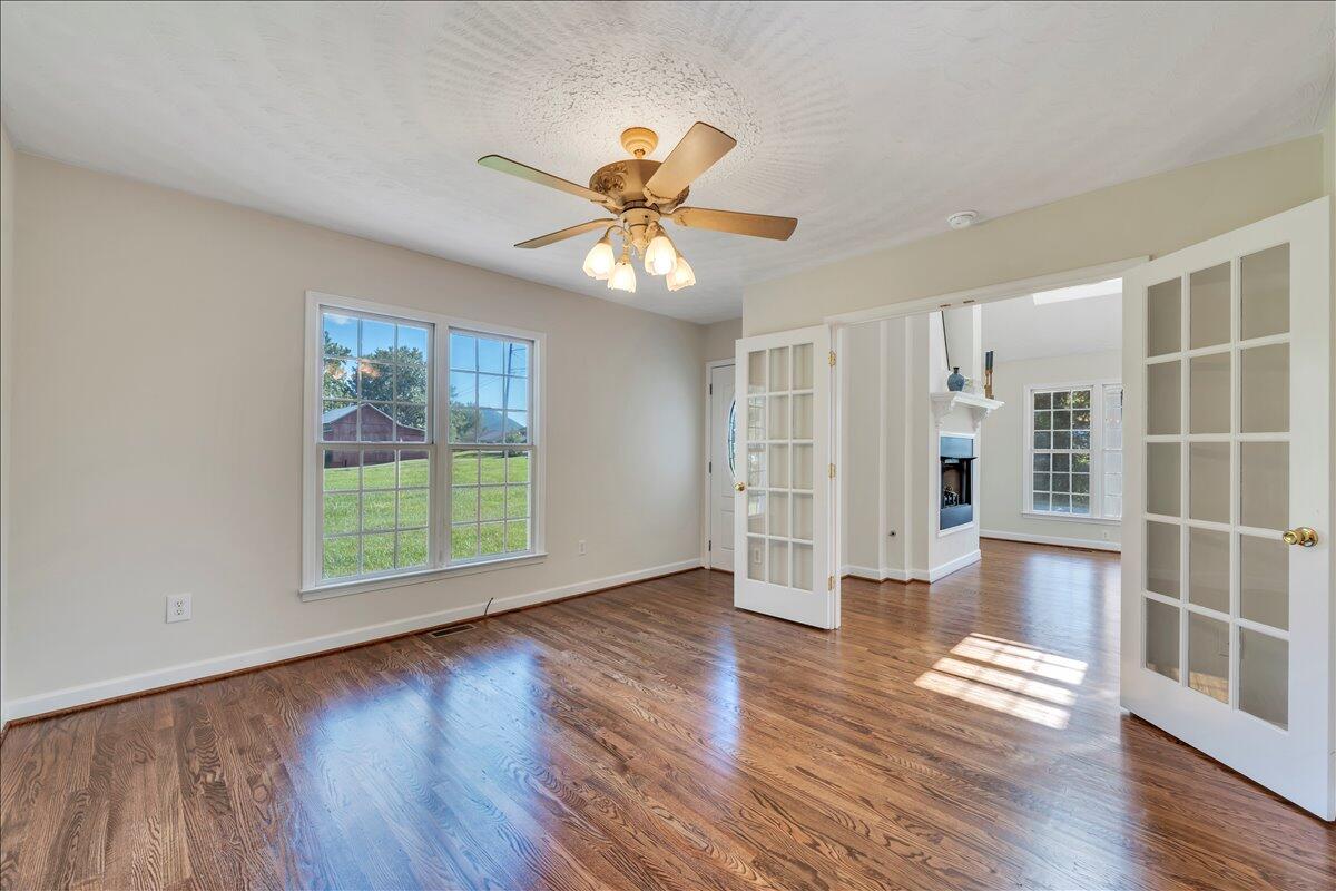 6510 Brookfield Road Roanoke, VA 24019 - Photo 28 of 119 a view of an empty room with a window and wooden floor