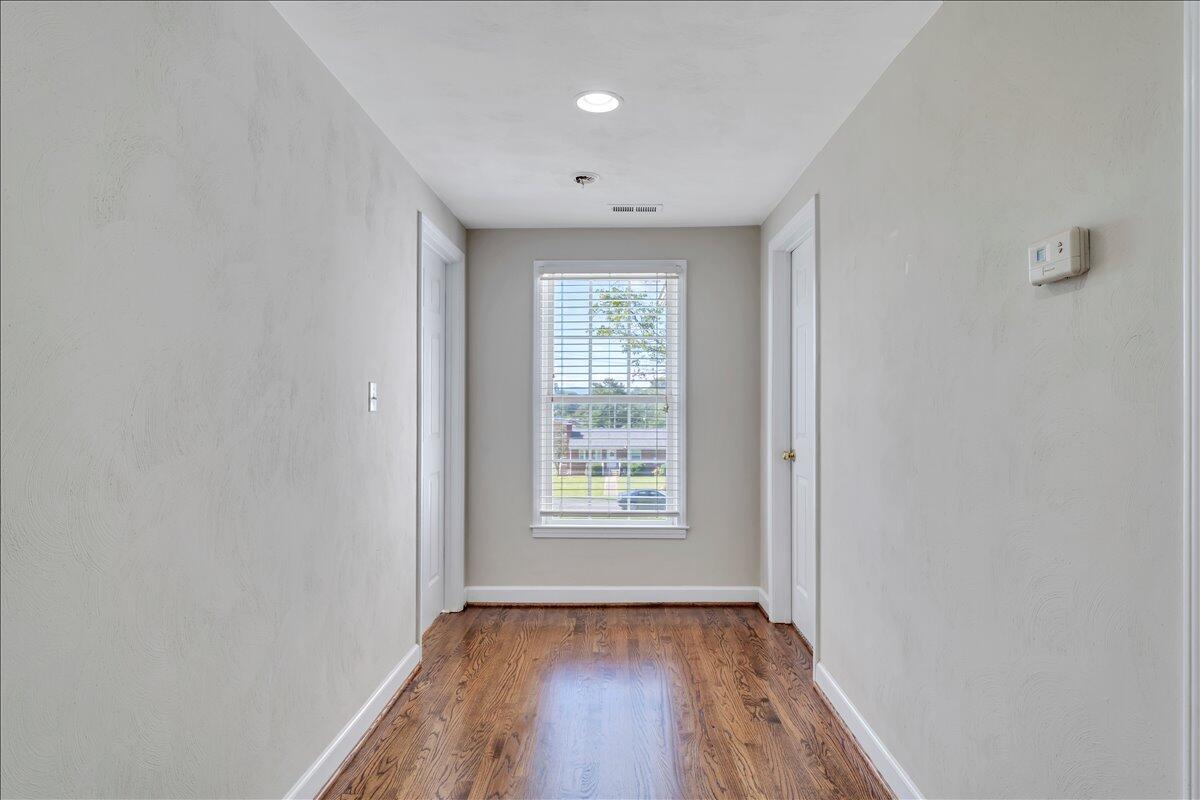 6510 Brookfield Road Roanoke, VA 24019 - Photo 70 of 119 a view of an empty room with window and wooden floor