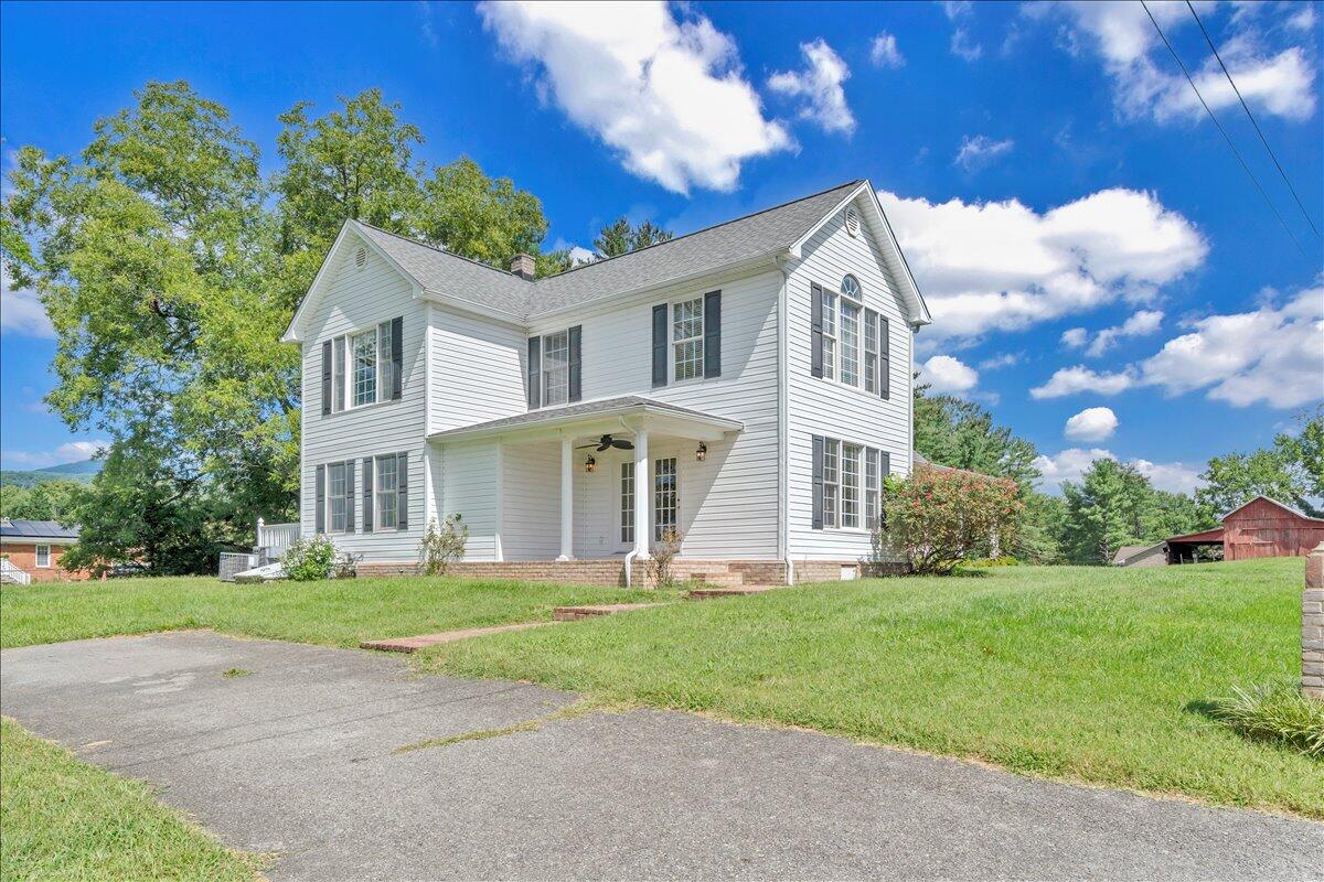 6510 Brookfield Road Roanoke, VA 24019 - Photo 90 of 119 a front view of a house with a garden and trees