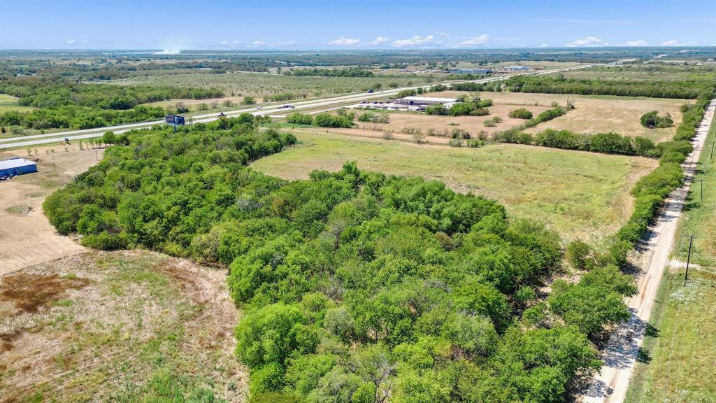 4985 Gibbons Road Sherman, TX 75092 - Photo 1 of 1 Looking SW. Gage Rd on the right, US Hwy 82 on the left. Subject goes from US Hwy 82 W to Gage Rd, and contains approximately 8.79 acres.